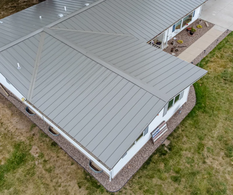 Low-slope metal roof on a residential home A low-slope metal roof on a residential home